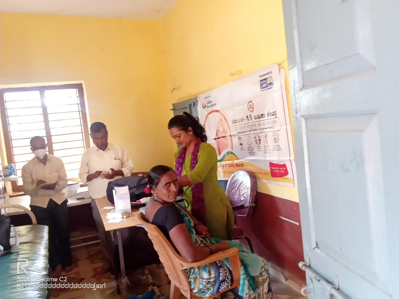 https://1ngo.sgp1.digitaloceanspaces.com/media/smks/1NGO-00137-SMKS Rural Development Society-Activities-COVID-19 Vaccination program-Bisnal.png